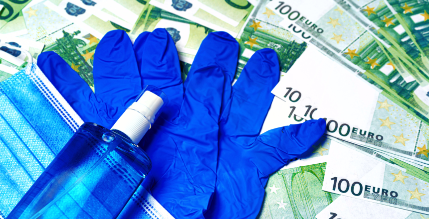 Protective medical mask, gloves and sanitizer on a background of Euro banknotes